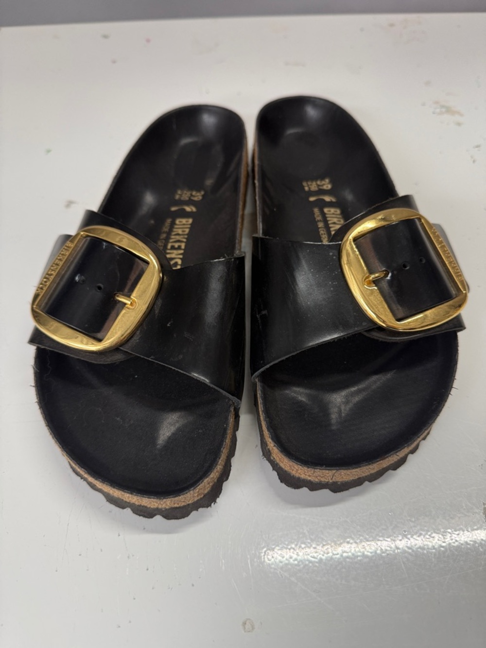Birkenstock Black Sandals with Gold Buckle Accent